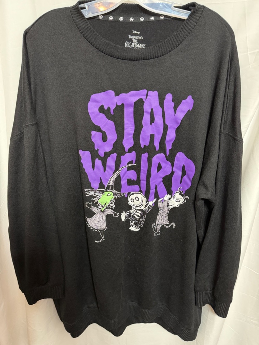 Black Graphic Pullover with Purple "STAY WEIRD" Lettering